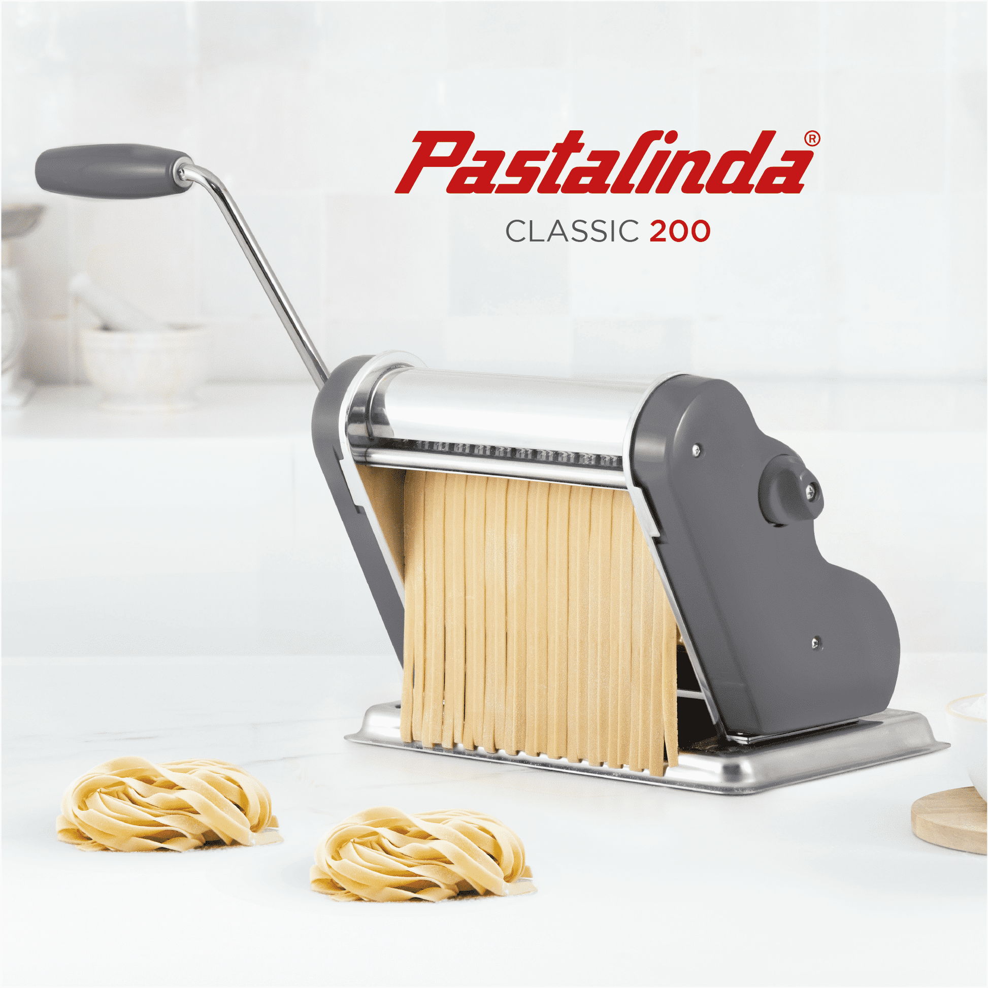 https://www.pastalindausa.com/cdn/shop/files/pastalinda-pasta-maker-machine-default-title-pastalinda-classic-200-gray-pasta-maker-machine-with-hand-crank-and-two-clamps-41574261489945.png?v=1698235414&width=1946